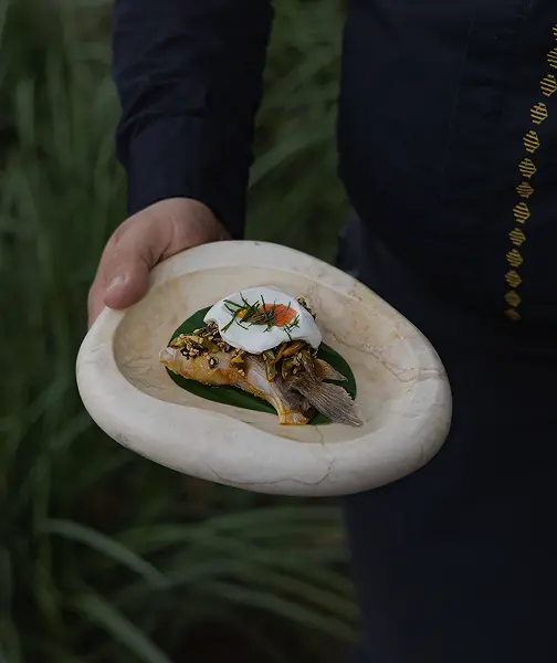 A person preparing a gourmet dish.